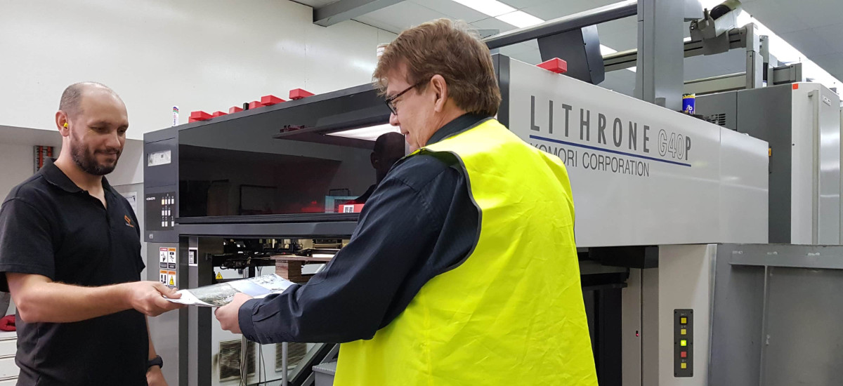 staff at Alpha Mail using industrial printer