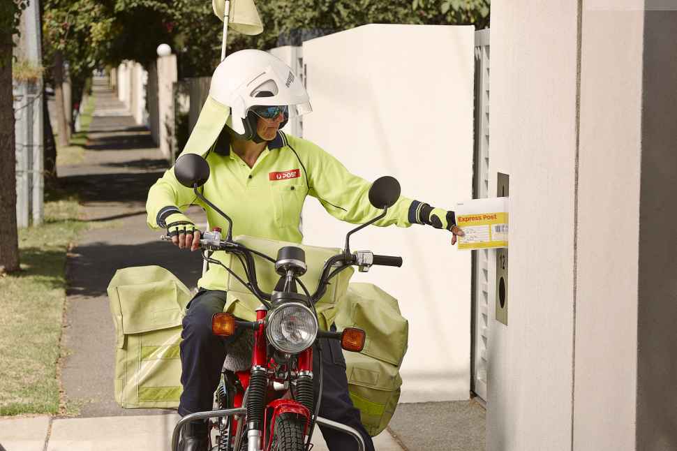 Postman delivering Alpha Mail
